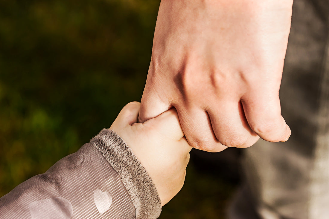 childproof door lock - adult holding child's hand